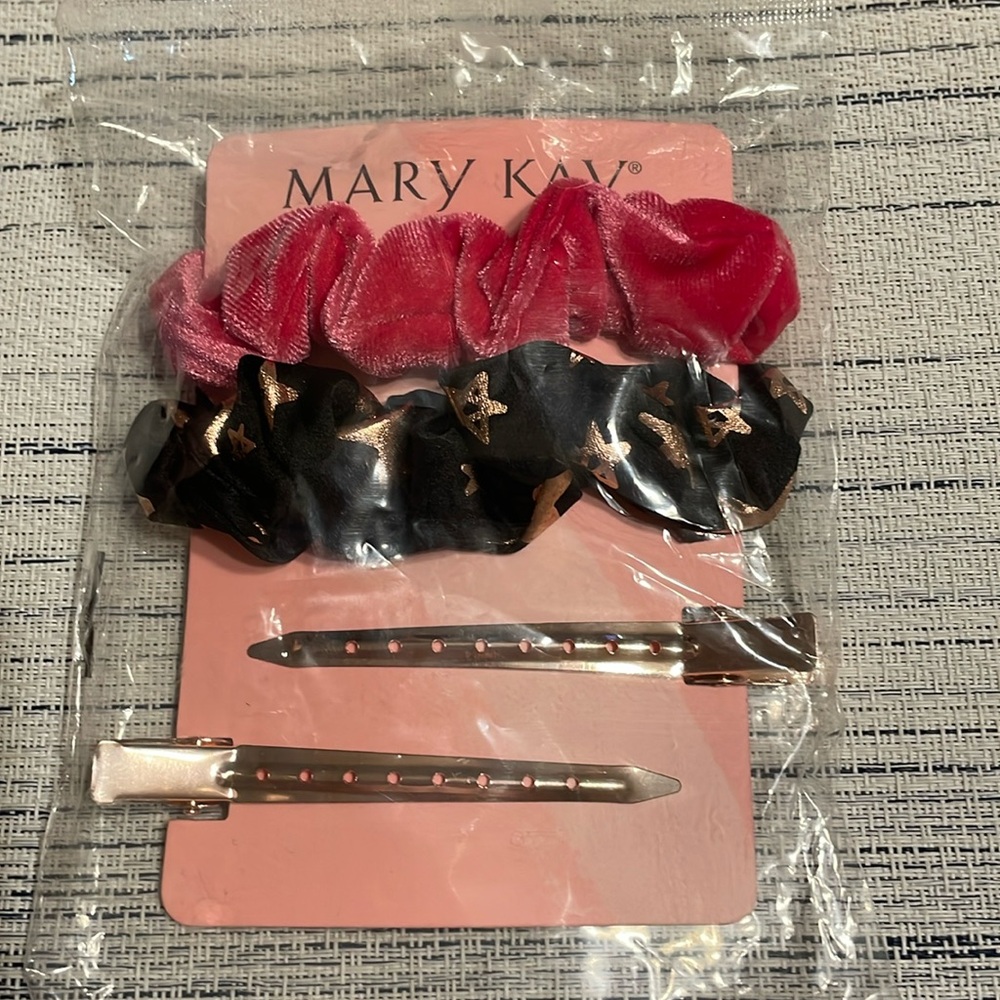 Mary Kay- 2 gold colored hair clips &  2 scrunchies- 1 pink,1 black w/gold stars